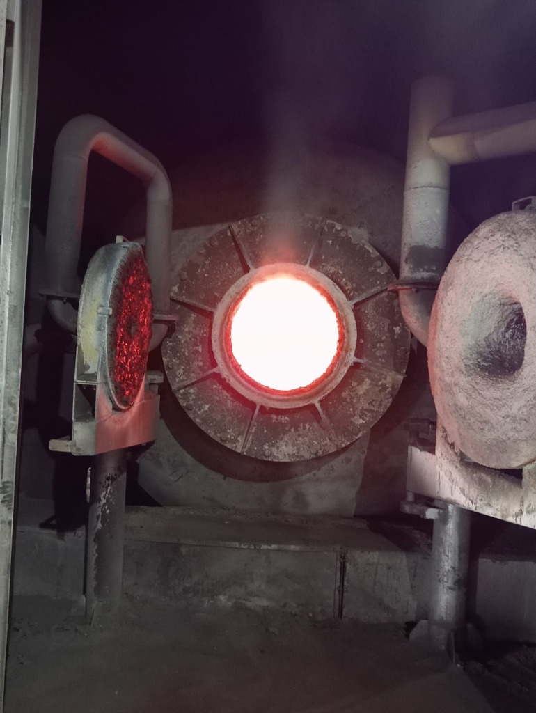 Rotary furnace glowing at operational temperature during lead smelting