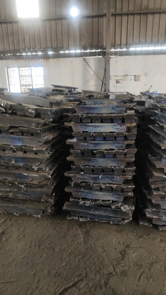 Lead ingot storage stacks arranged inside the facility warehouse