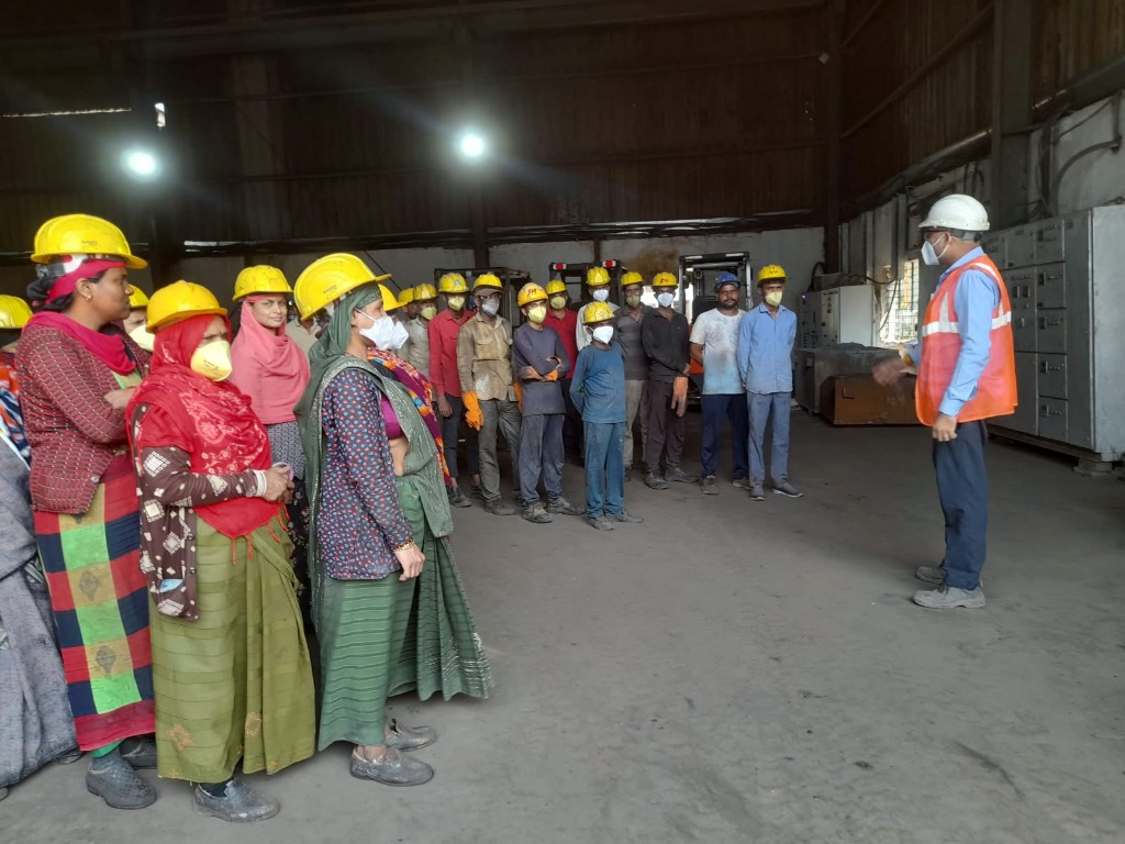 Shift safety briefing, worker PPE protocols and occupational health at Dewas facility